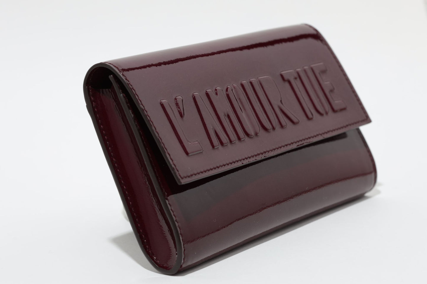 L'AMOUR TUE CLUTCH BAG LAMB VARNISH